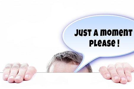 person's forehead and hands with just a moment please! bubble chat thumbnail