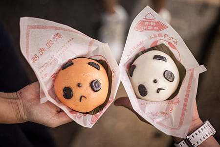 two person holding panda burgers thumbnail