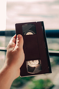 person holding VHS tape thumbnail