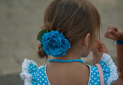 girl wearing blue floral hair bow thumbnail