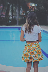 woman standing near the pool thumbnail