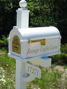 white wooden mail near grass thumbnail