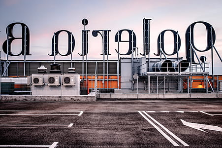 gray metal signage during daytime thumbnail