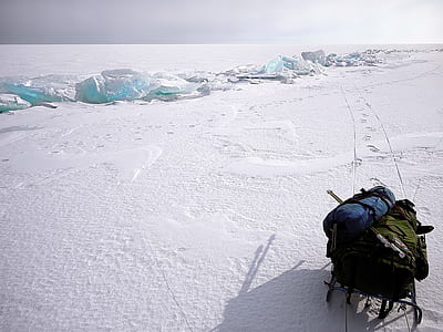 blue and green bag in black sled thumbnail
