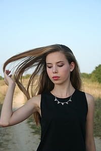 woman wearing black sleeveless top thumbnail