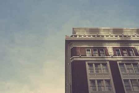 worm's-eye view of brown and white painted building thumbnail