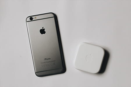 space gray iPhone 6 on top of white surface thumbnail