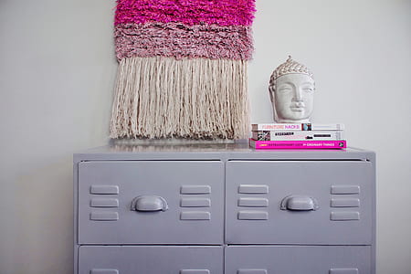 Buddha head bust on top of three books thumbnail
