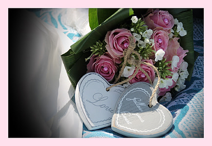 pink and white rose bouquet on white and blue surface thumbnail