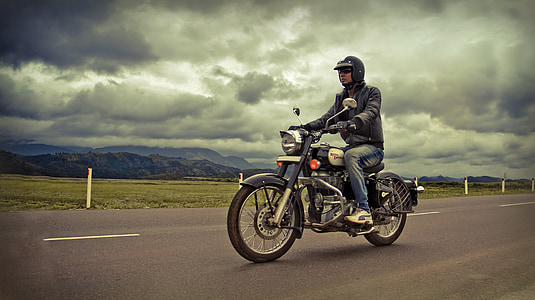 man riding motorcycle on road thumbnail