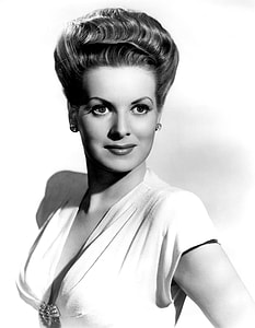 grayscale photo of woman wearing V-neck top [ thumbnail