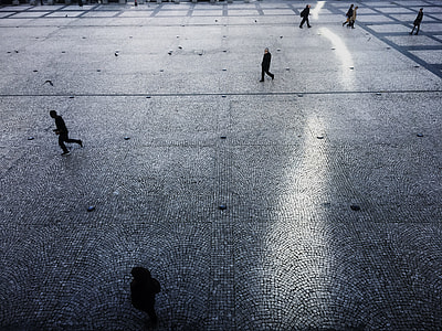 people walking on concrete walkway thumbnail
