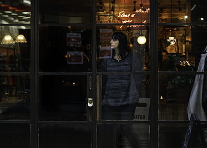 woman in front of glass window thumbnail