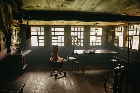 brown wooden dining table with chairs inside room during daytime thumbnail