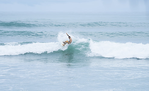 man surfing on wave thumbnail