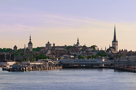 landscape photo of body of water and castle during daytime thumbnail