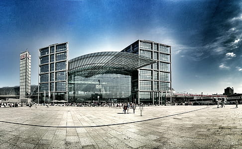 people walking towards building during daytime thumbnail