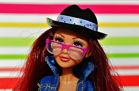 Barbie doll with pink eyeglasses and blue denim jacket thumbnail