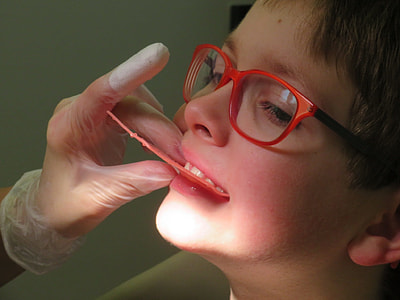 boy wearing red framed eyeglasses thumbnail
