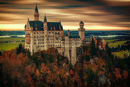 white and teal castle near sea thumbnail