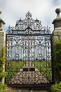 closed black metal scrolled gate thumbnail
