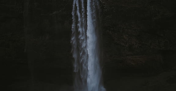 concrete hill with waterfall photo thumbnail