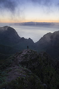 person standing on cliff thumbnail
