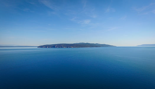 aerial view of body of water near island thumbnail