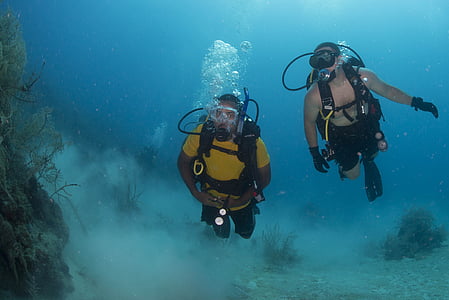 two men scuba diving in water thumbnail
