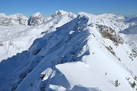 snow covered mountain under white sky at daytime thumbnail
