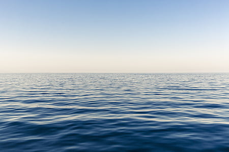calm blue body of water at daytime thumbnail