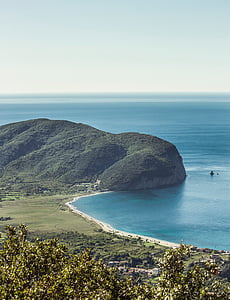body of water near mountain thumbnail