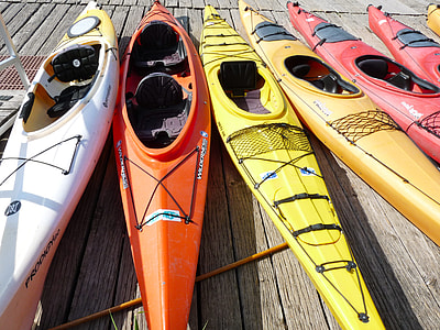 kayaks on brown plank thumbnail