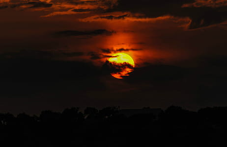 Photo of Full Moon Surrounded by Clouds thumbnail
