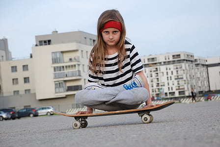 girl sitting on skateboard thumbnail