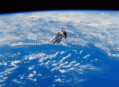 astronaut floating on space above earth thumbnail