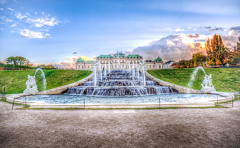 water fountain between green grass field painting thumbnail