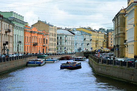 blue and red boat during daytime thumbnail