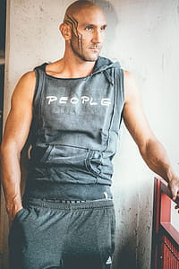 Man Wearing Black Tank Top thumbnail