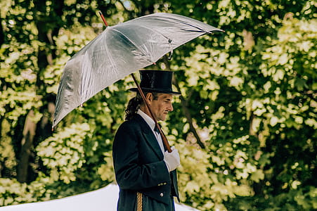 Man Holding Umbrella thumbnail