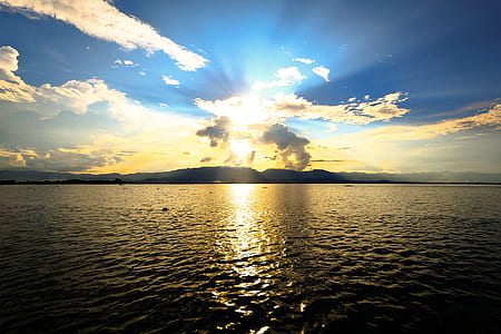 silhouette of island during golden hour thumbnail