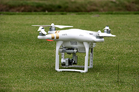 white DJI Phantom 3 Professional on green grass thumbnail