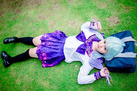 woman lying down on grass field thumbnail