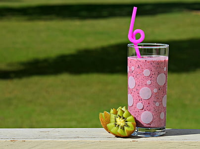 white drinking glass filled with pink liquid thumbnail