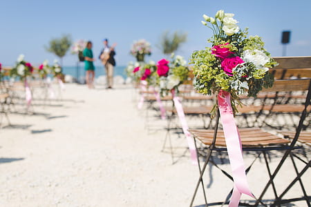 selective focus photography of wedding aisle flower arrangement thumbnail