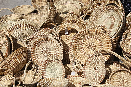 brown wicker basket lot on gray concrete ground at daytime thumbnail