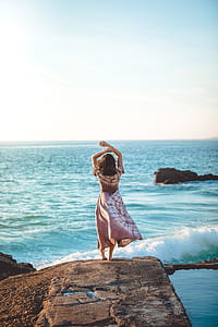 woman standing on cliff thumbnail