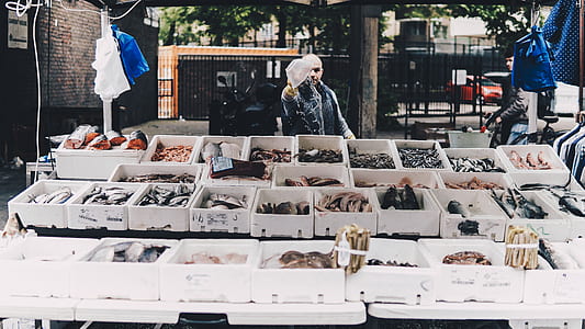 man at food stand during day thumbnail