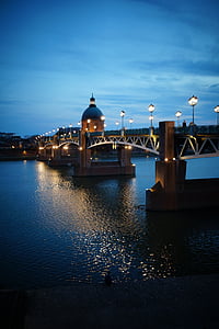 lighted bridge beside dome building thumbnail