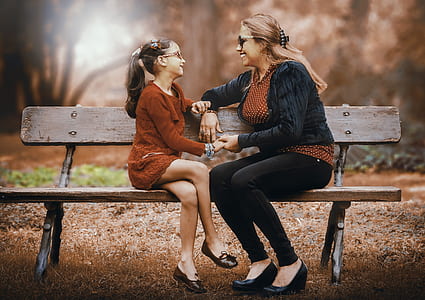 mother and daughter sitting on the bench thumbnail
